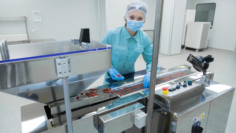 Operators working in a pharmaceutical production area