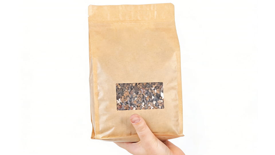 A kraft-paper DoyPack in hand