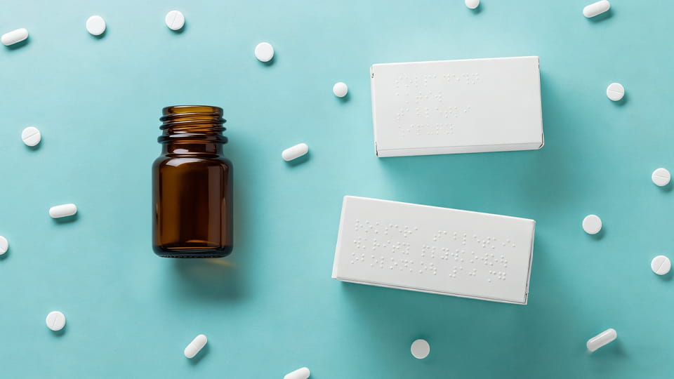 pharmaceutical folding carton with braille alphabet