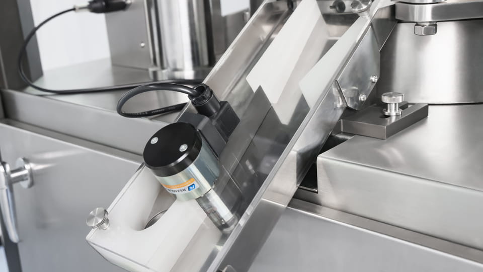 Tablet press reject and discharge port