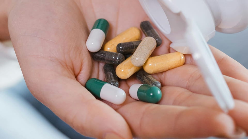 Various capsules in hand