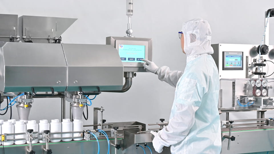 Worker operating the counting bottling machine
