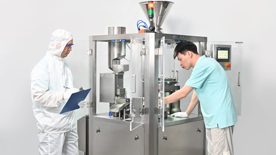 Workers are maintaining tablet press