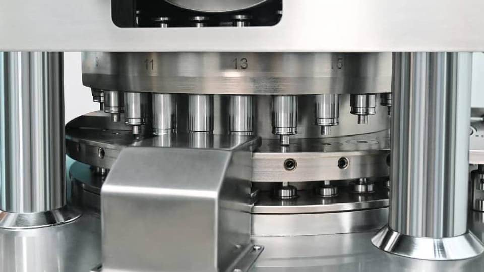 Close-up of the tablet press turntable