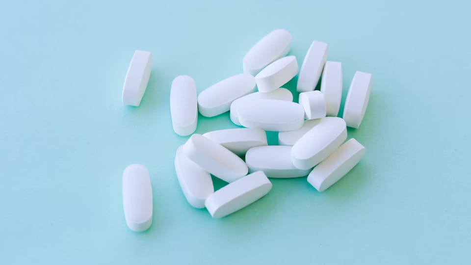 clean white tablets by tablet Deduster machine