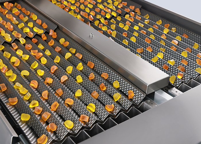 Dimpled Vibration Channels in gummy counting machine