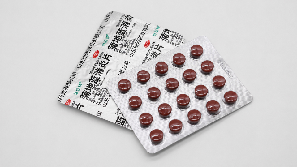 Individual pills sealed in a blister card printed with dosing info