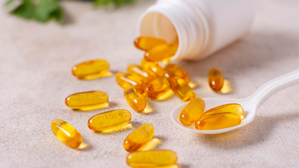 Softgel capsules with spoon and pill bottle
