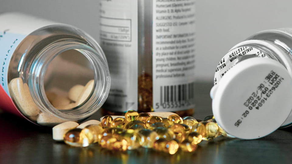 Supplements bottles with induction foil under caps