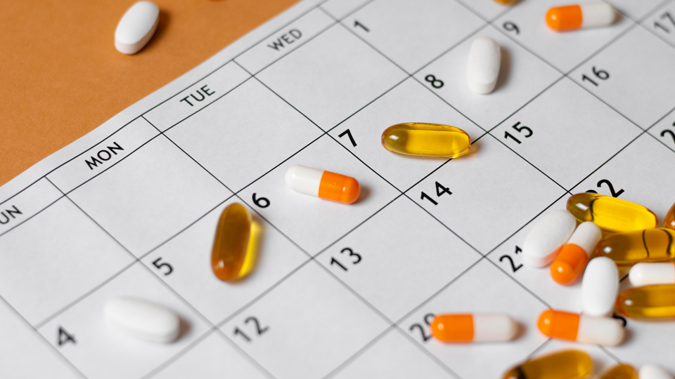 tablets and capsules on calendar