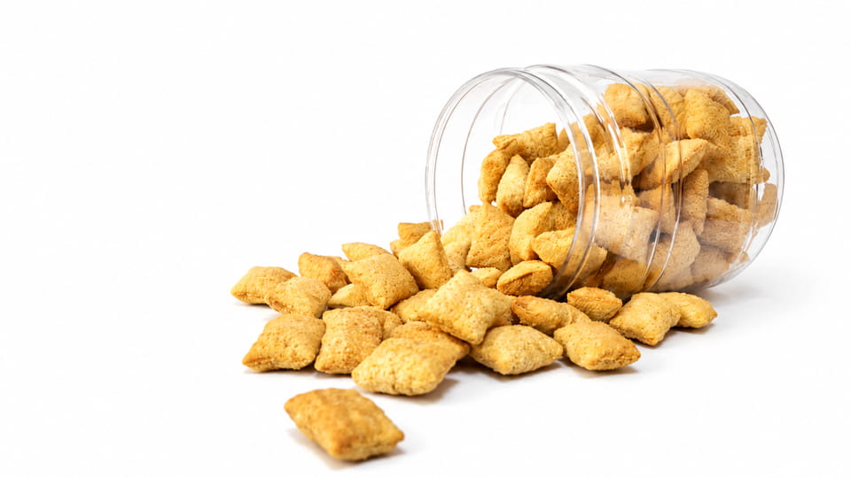 Snacks spilled out of a plastic can