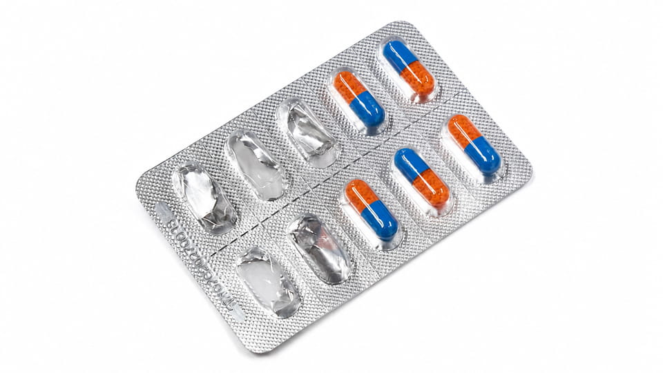 a blister pack with individual capsules sealed in thermoformed plastic pockets