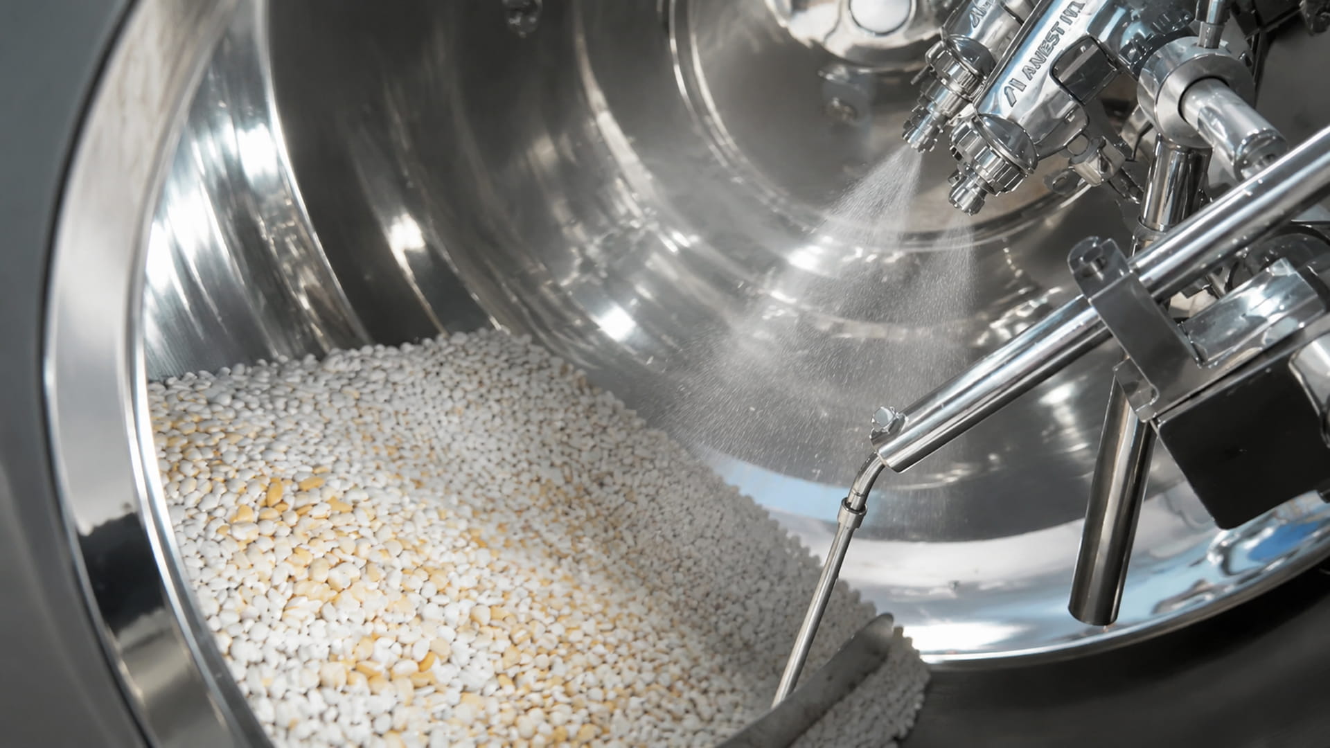high-speed tablet coating machine applying a film coating