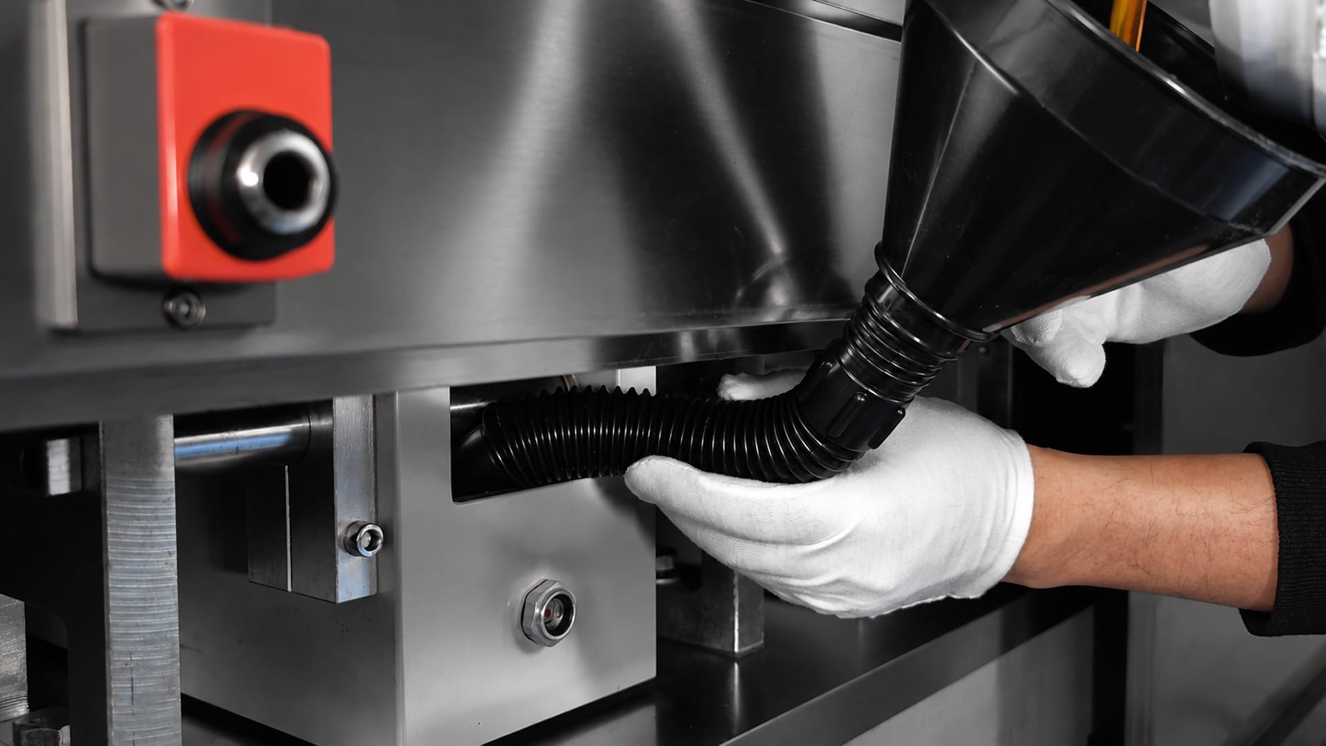 A mechanic adding Lubricant oil to a blister packing machine