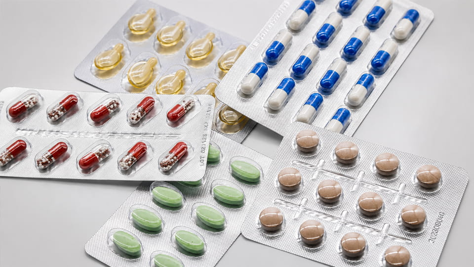 Thermoformed pharmaceutical blister packaging samples with tablets and capsules