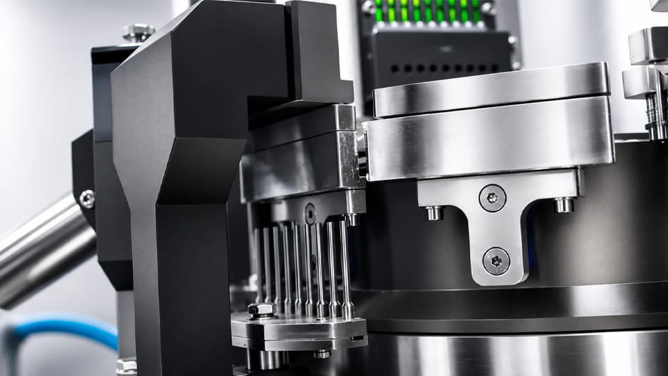 Capsule locking station after powder filling, where brittle capsule shells may fracture and moisture-softened shells may deform during closing.