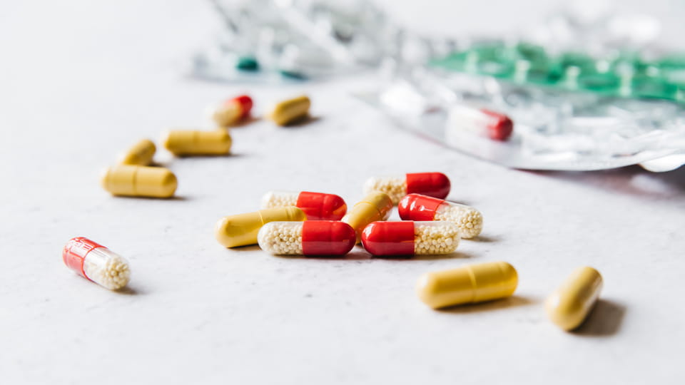 Hard capsules containing enteric-coated pellets shown with conventional capsules.
