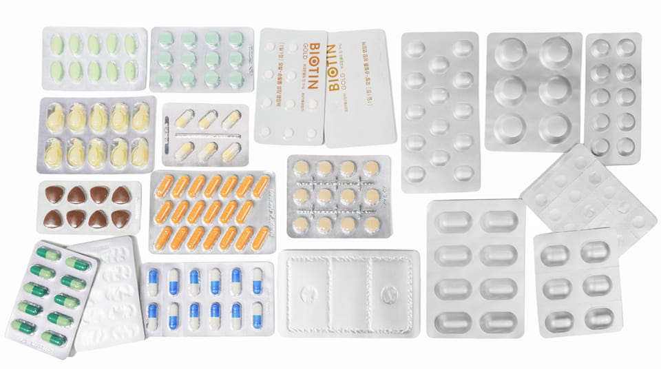 Assorted pharmaceutical blister packs with different tablet and capsule shapes, cavity sizes and packaging configurations.