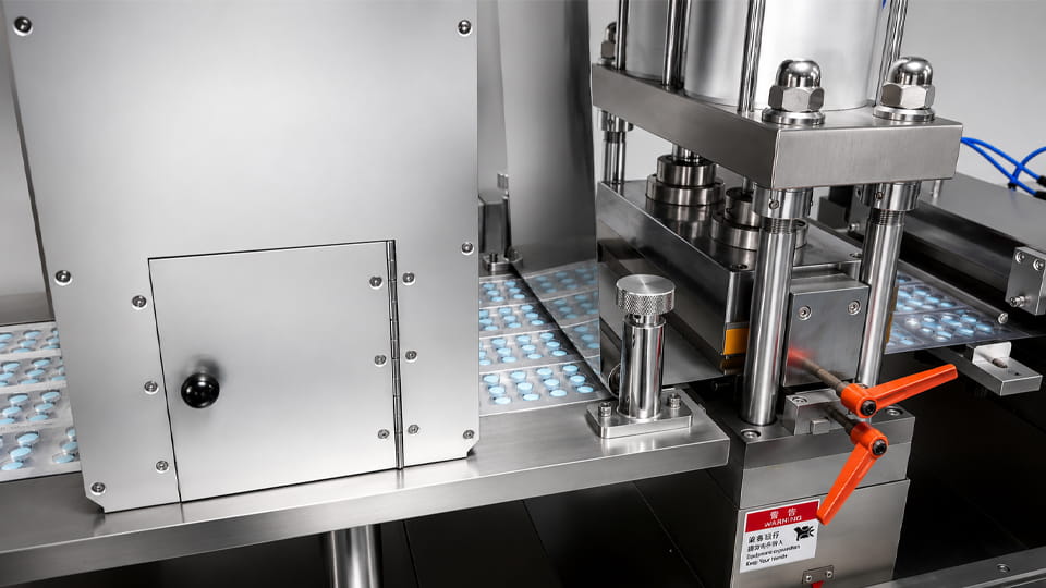 Pharmaceutical blister packaging machine operating on a tablet packaging line.