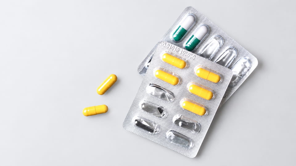 Push-through blister packaging with capsules in individual cavities, designed for direct push-through access.