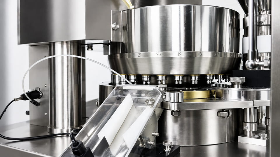 Rotary tablet press operating during pharmaceutical tablet compression and process control.
